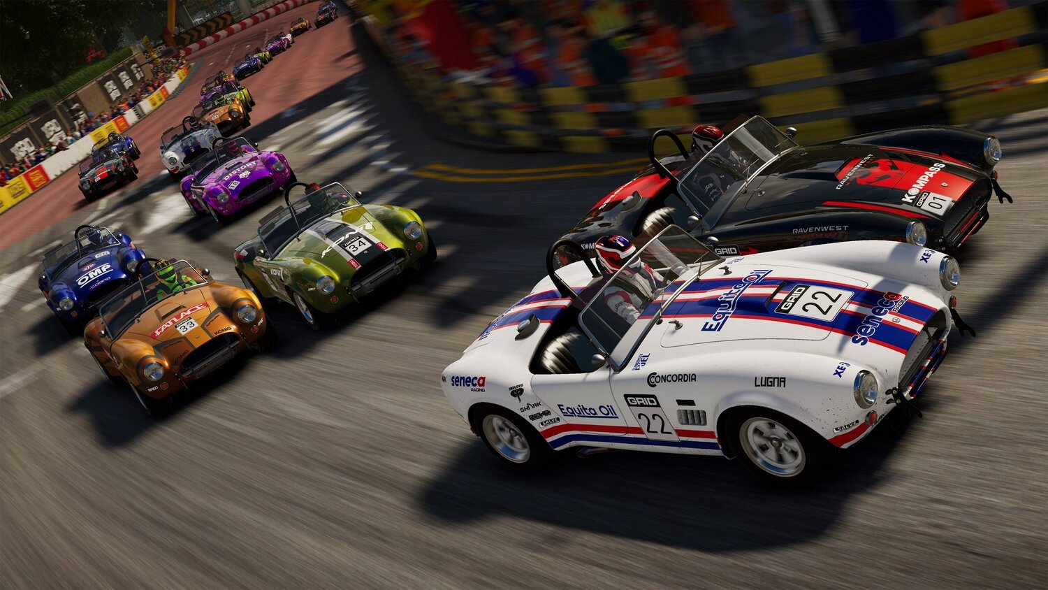 Two race cars competing at dusk.
