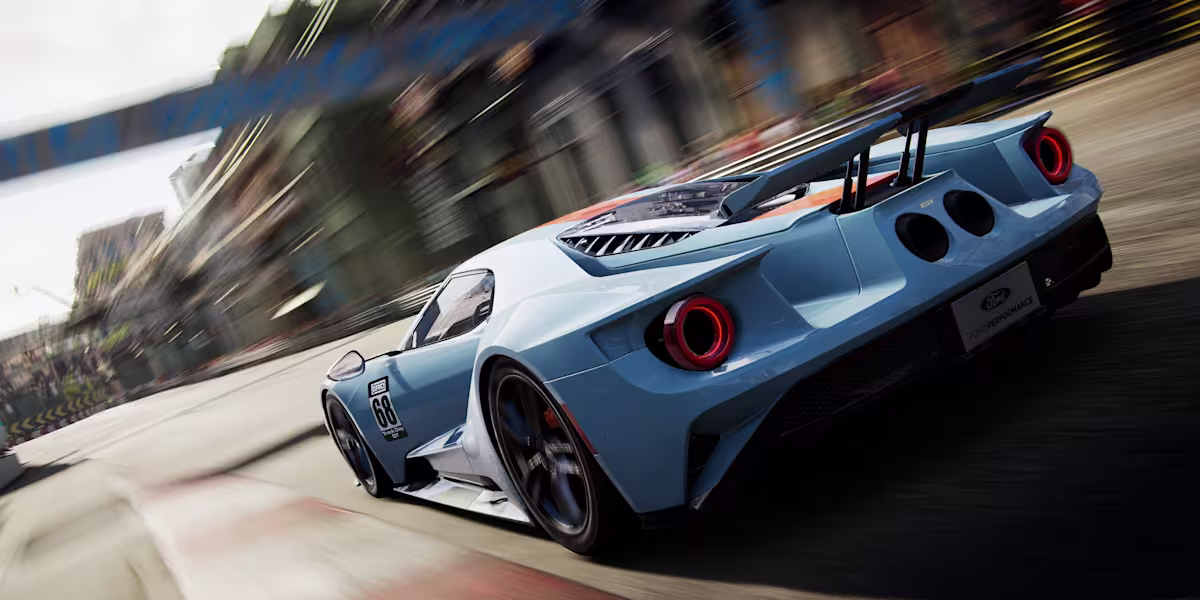 Racing cars approaching a circuit corner.